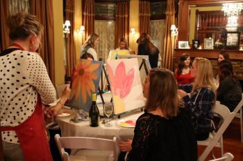 ladies painting at a bachelorette party