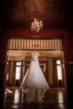 bride dress hanging from ceiling