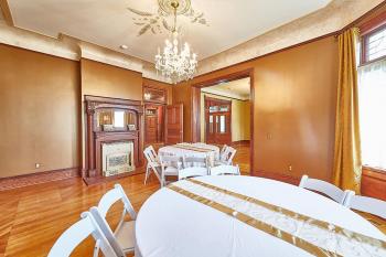 tables setup in one of the mansion's parlors