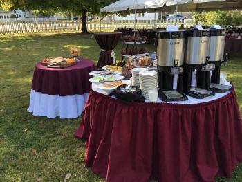 tables setup for a wedding outside of the mansion